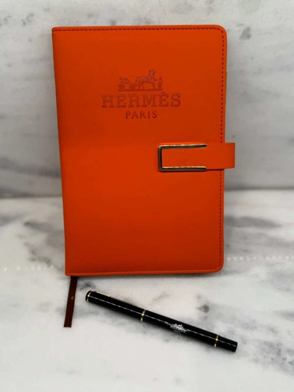 Hermes Orange notebook with pen.  Bonus dustbag!